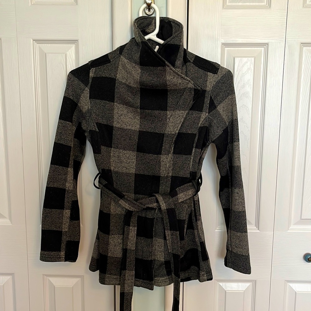Buffalo Plaid knit jacket with belt. Zip closure, exterior side slit pockets.
